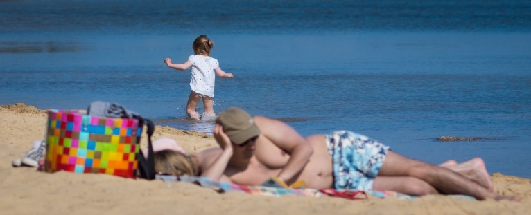 Dozing on the Beach with a Toddler | Island Real Estate