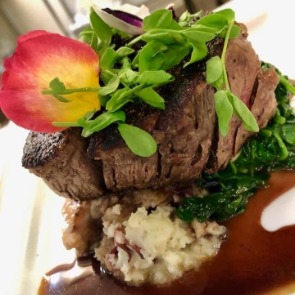 steak filet at Beauchaine's 211 | Island Real Estate