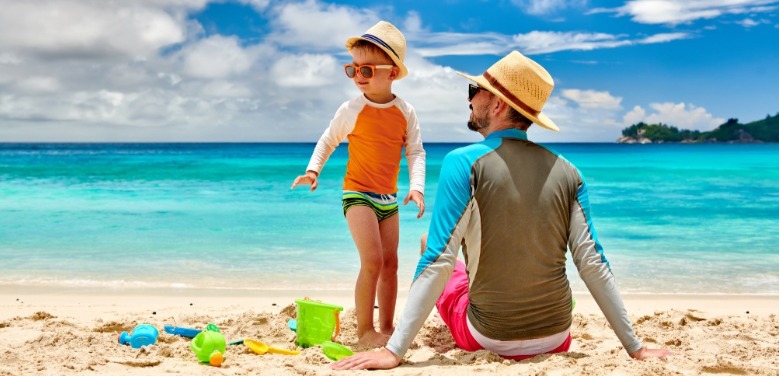 Father and Son Wearing Rash Guard Shirts | Island Real Estate