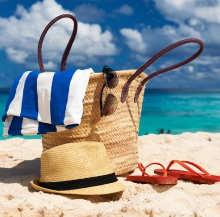 beach bag sitting on the beach | Island Real Estate