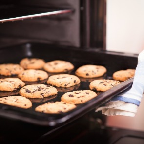 cookies going in oven | Island Real Estate