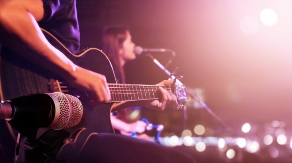 guitar and woman singing | Island Real Estate